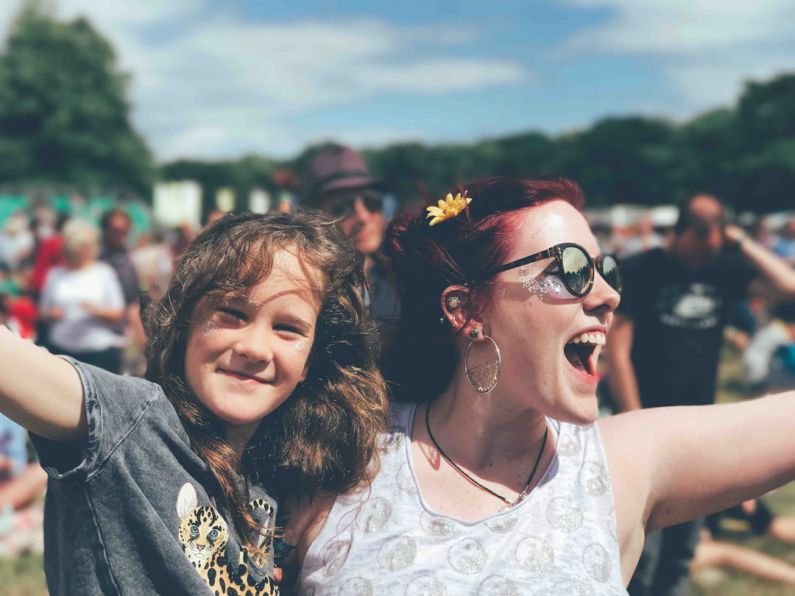 Family Fun - girl and woman near people at the field during day