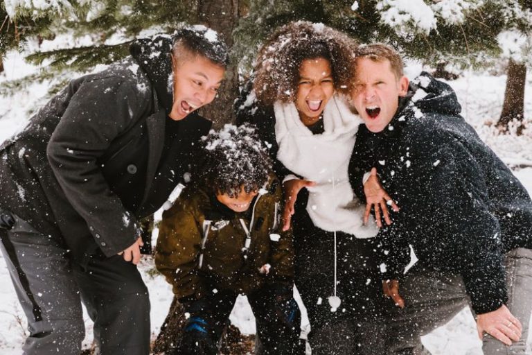 Family Fun - group of people standing on snowy field