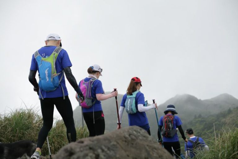 Activities - people standing on rock during daytime