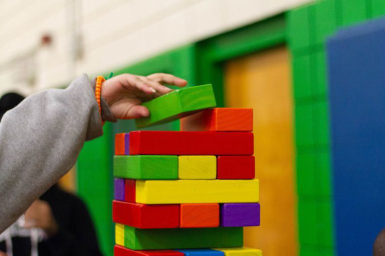 Activities - person piling blocks