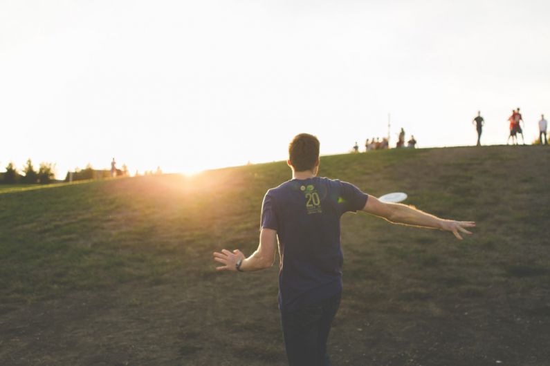 Activities - man walking on green grass field