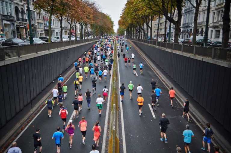 Activities - people running on road during daytime