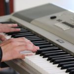 Activities - person playing piano inside room