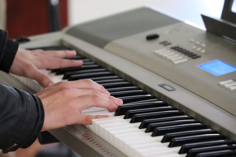 Activities - person playing piano inside room