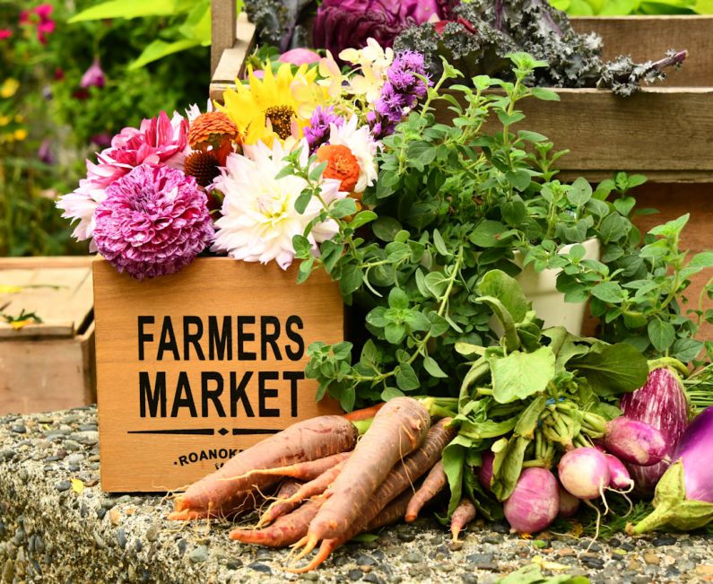 Farmers Market - purple and white flowers on brown wooden box