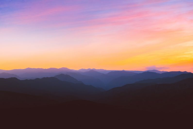 Outdoor - silhouette photo of mountain during golden hour