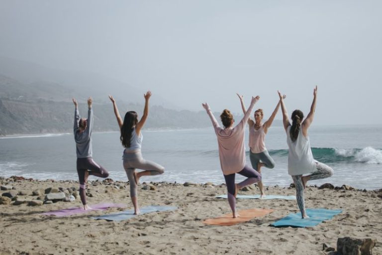 Wellness - five woman standing on seashore